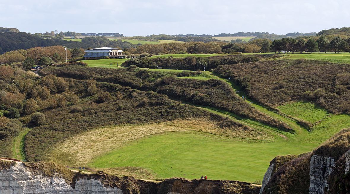 The golf course and clubhouse on the cliffside